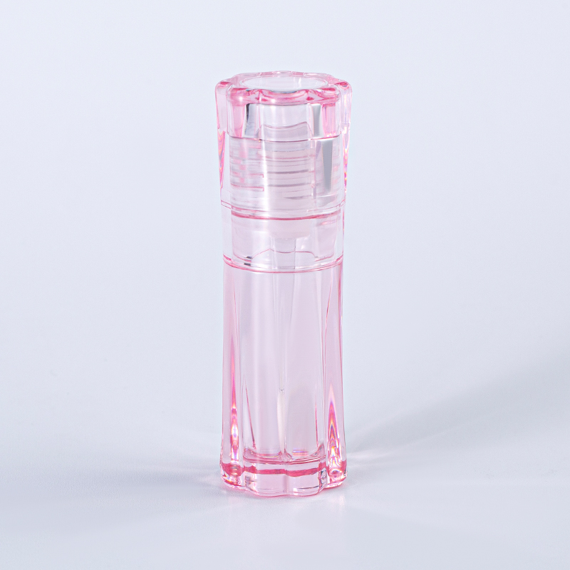 Tubo de brillo labial vacío con rayas verticales rosas
