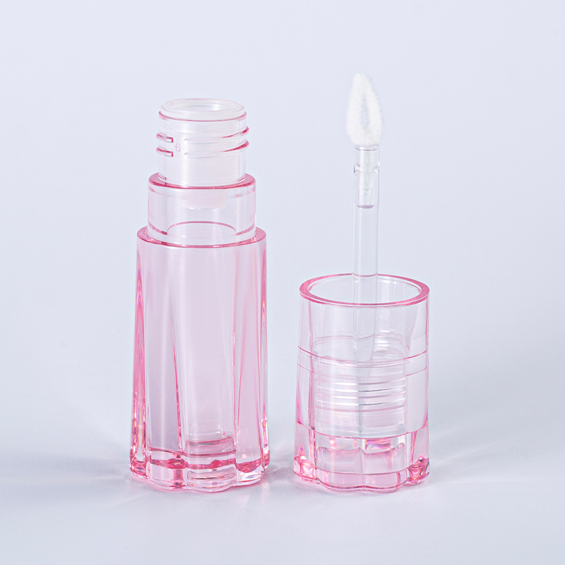 Tubo de brillo labial vacío con rayas verticales rosas