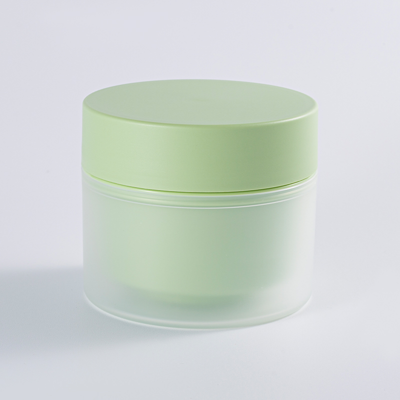 Tarro de crema cilíndrico con bloques de color